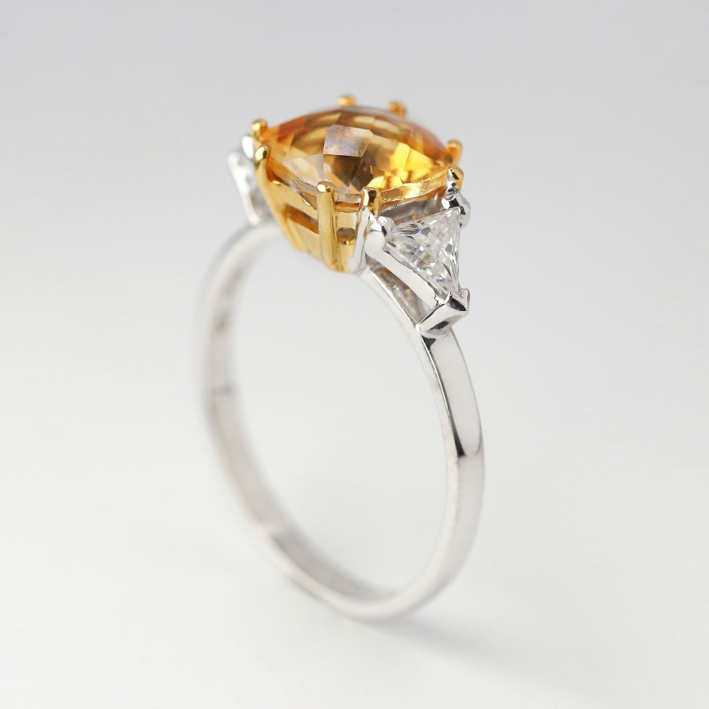 2ct- center, cushion cut, orange topaz gemstone .20ct- 1pc each side (2pcs in total), trilliant cut