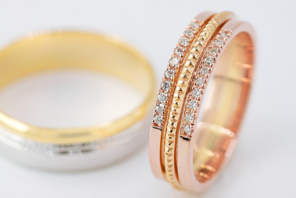 Groom: Plain band Bride: .008ct- 10pcs each sides, genuine diamond Center- milgrain