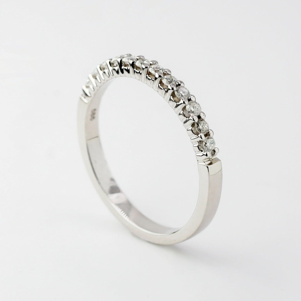 Round brilliant cut with .02ct center stone in eternity setting. The stone in the photo is swiss stone by default. You can definitely upgrade your stone into moissanite or genuine diamond with GIA certification. Grams Approx: 3