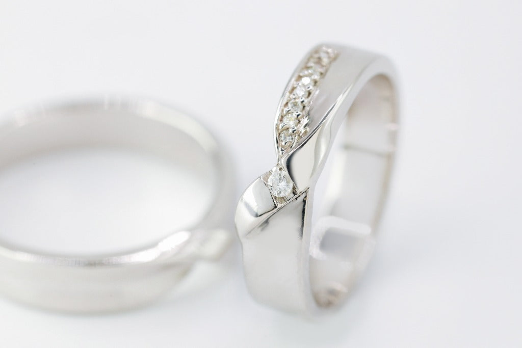 Groom: Plain with twisted Bride: .02ct- center .005ct- 8pcs