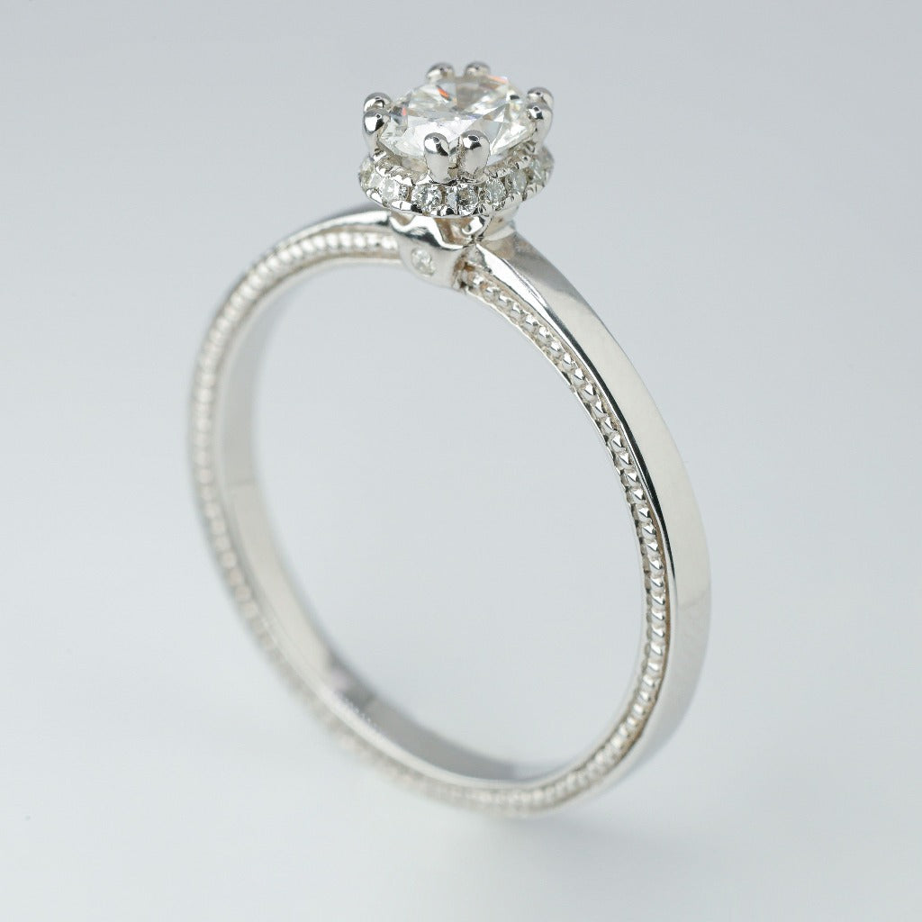 .50ct- center, oval cut .005ct- 23pcs, round cut