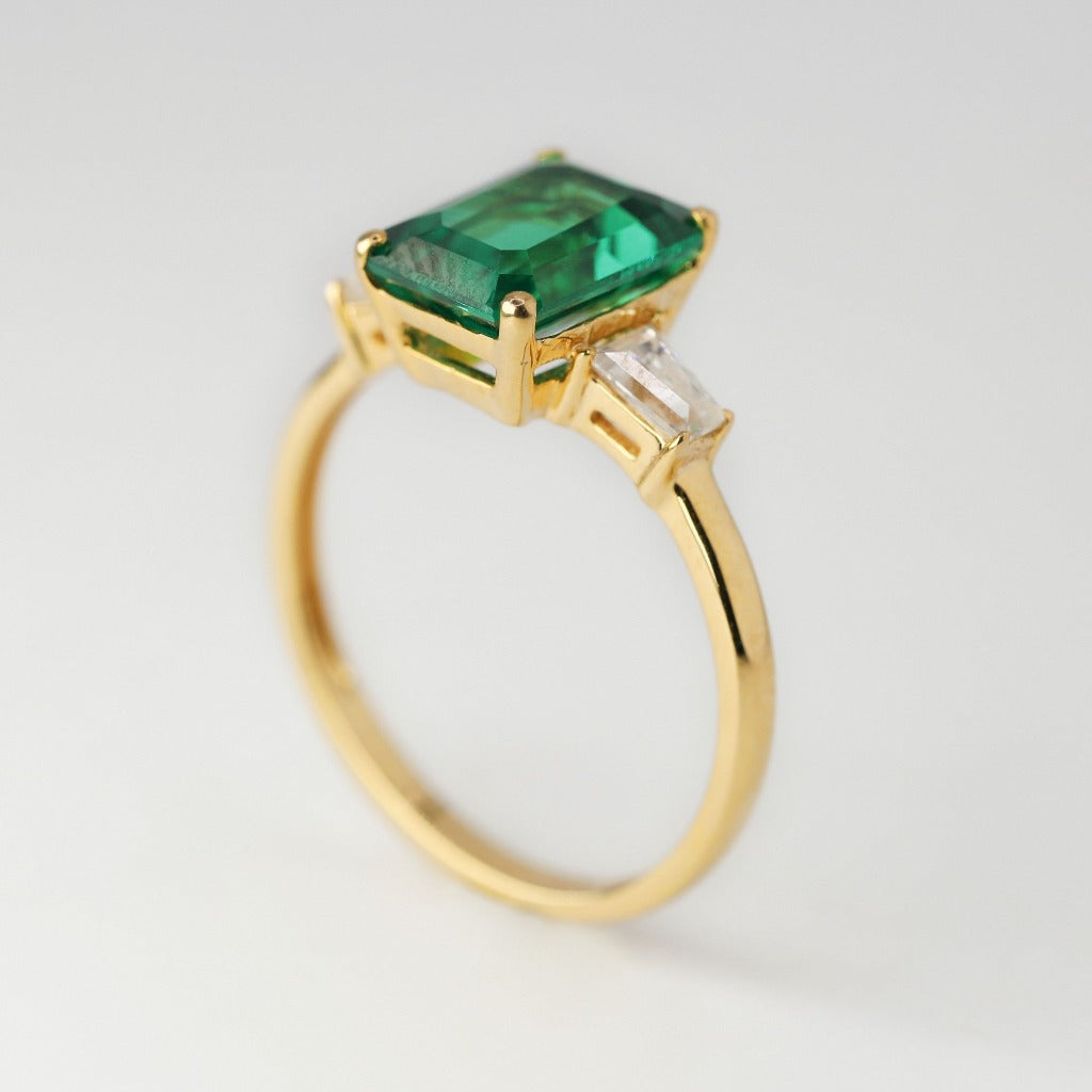 3ct- center, emerald cut, emerald gemstone .25ct – tapered baguette