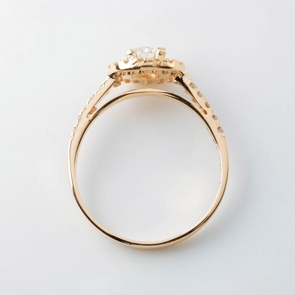 Round brilliant cut with 1ct center stone and round cut with .01ct in elegant halo setting. The stone in the photo is swiss stone by default. You can definitely upgrade your stone into moissanite or genuine diamond with GIA certification. Grams Approx: 3.5