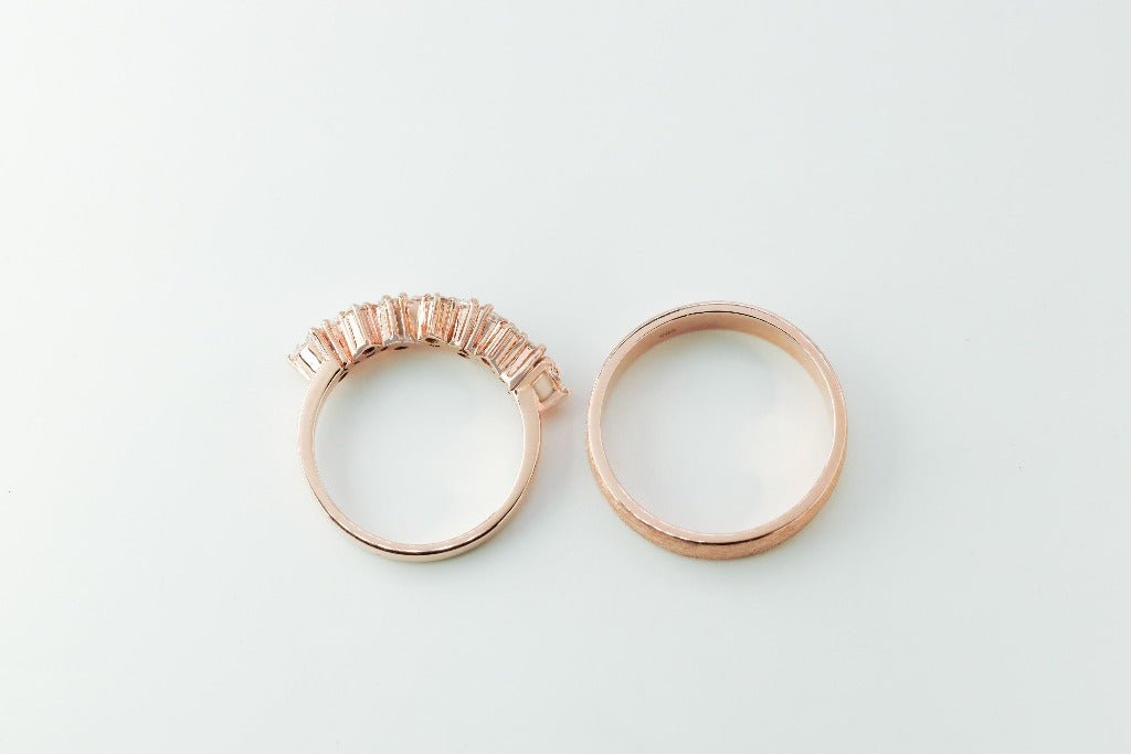 Groom: Plain band, glossy finish Bride: .04ct - 8pcs, marquise cut, genuine diamond .03ct - 7pcs, round cut