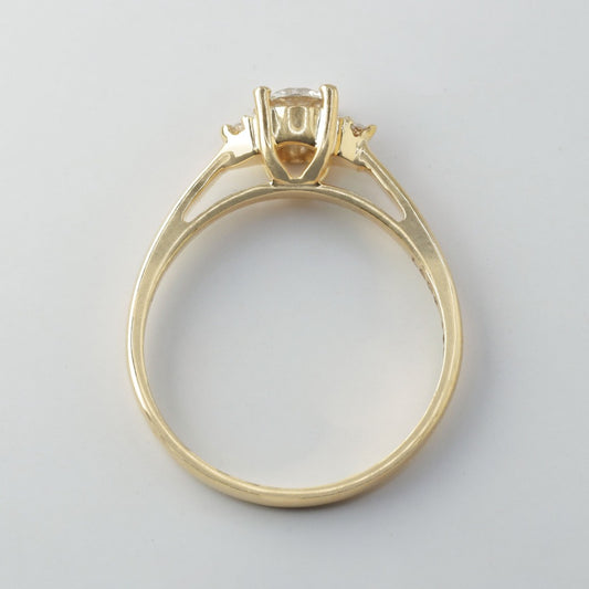 Round brilliant cut with .50ct center stone in classic solitaire setting. The stone in the photo is swiss stone by default. You can definitely upgrade your stone into moissanite or genuine diamond with GIA certification. Grams Approx: 3