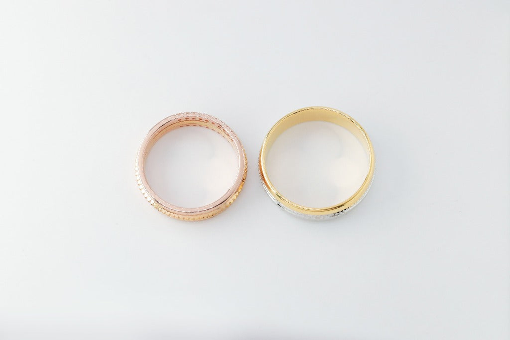 Groom: Plain band Bride: .008ct- 10pcs each sides, genuine diamond Center- milgrain