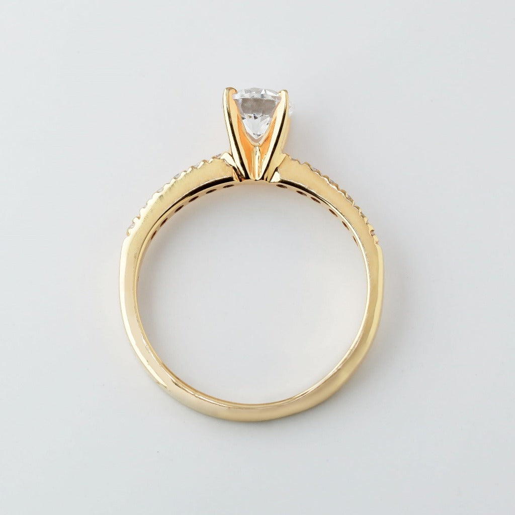 Round brilliant cut with 1ct center stone and .01ct sides stones in timeless pave setting. The stone in the photo is swiss stone by default. You can definitely upgrade your stone into moissanite or genuine diamond with GIA certification. Grams Approx: 3