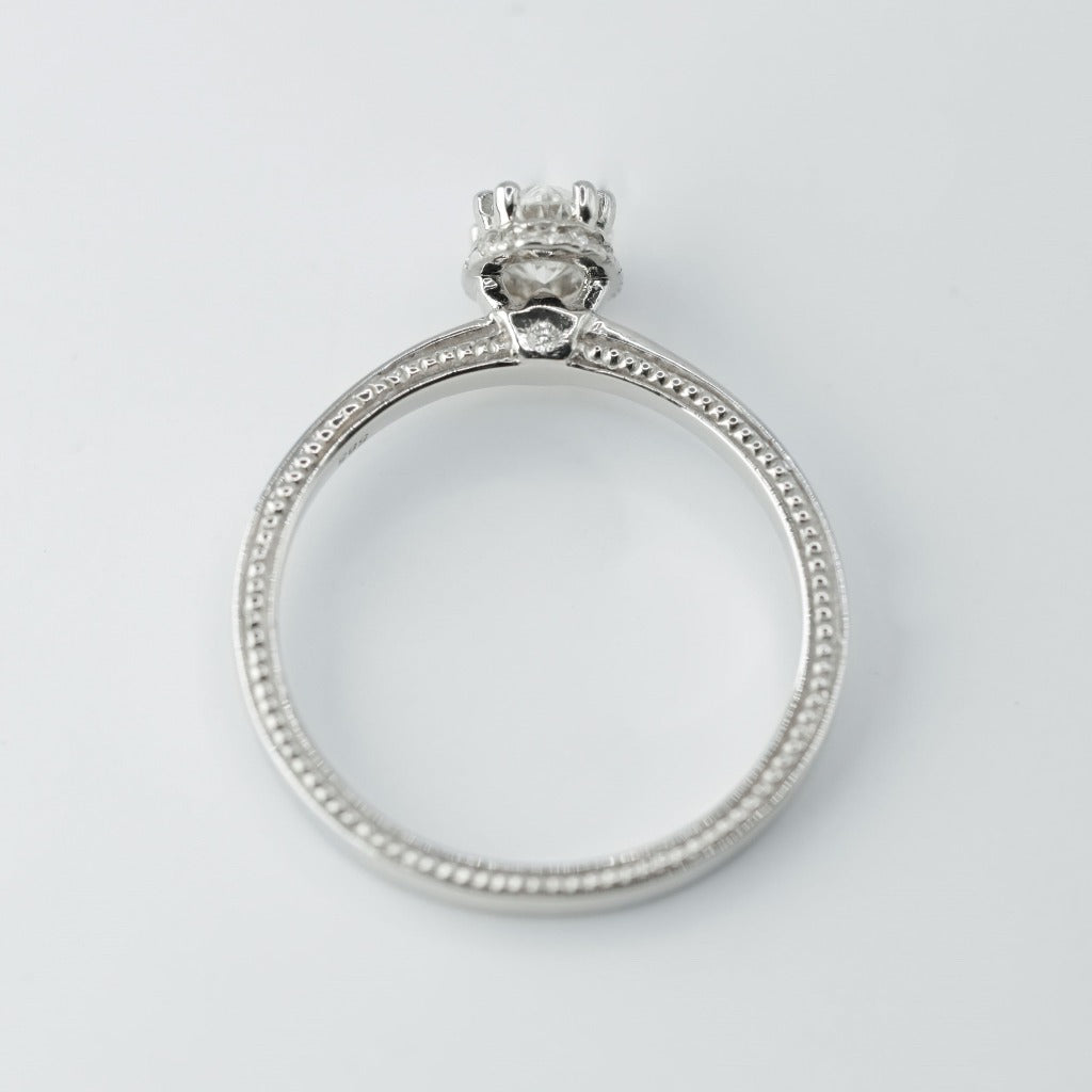 .50ct- center, oval cut .005ct- 23pcs, round cut