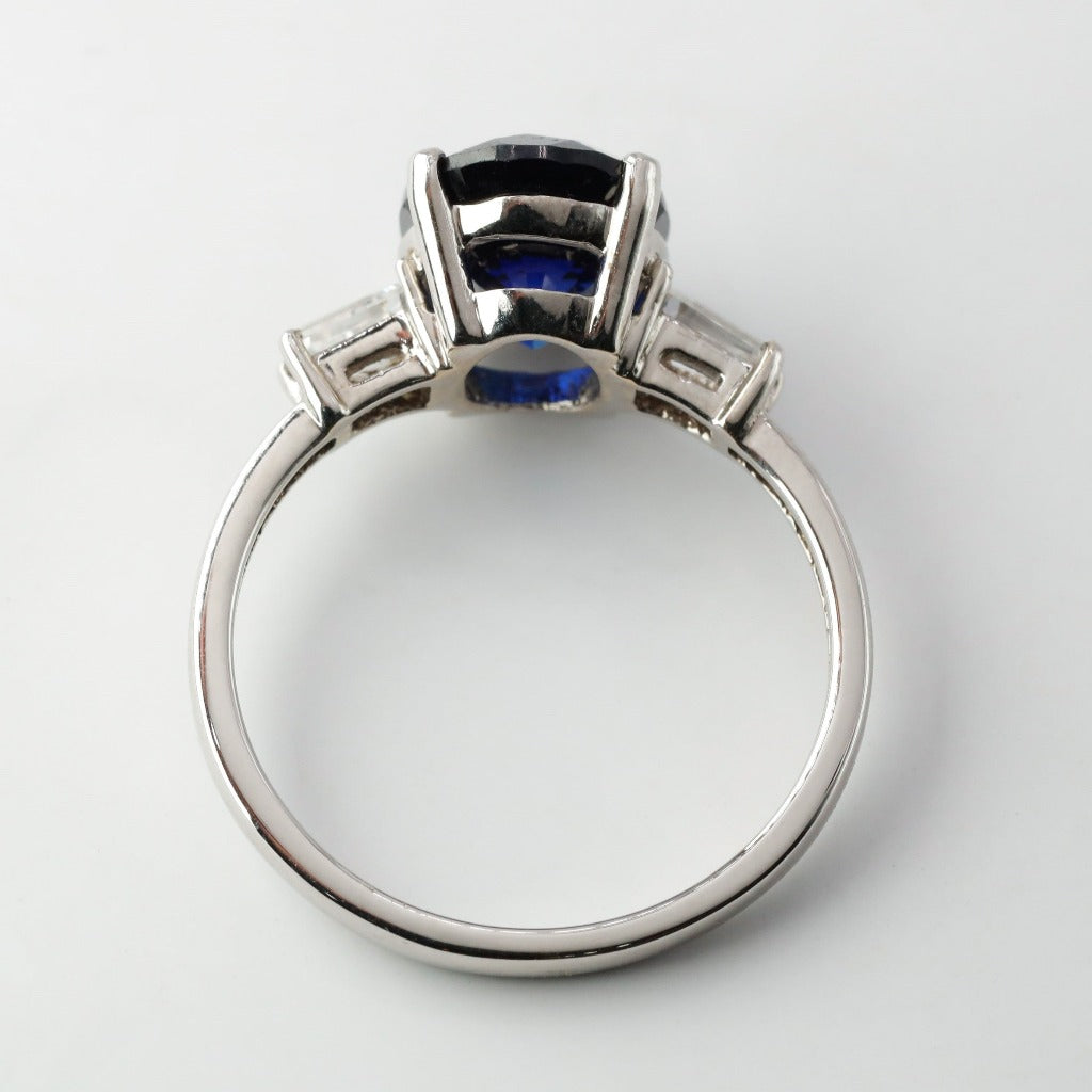 3ct- center, oval cut, blue sapphire gemstone .25ct- 1pc each side, tapered baguette
