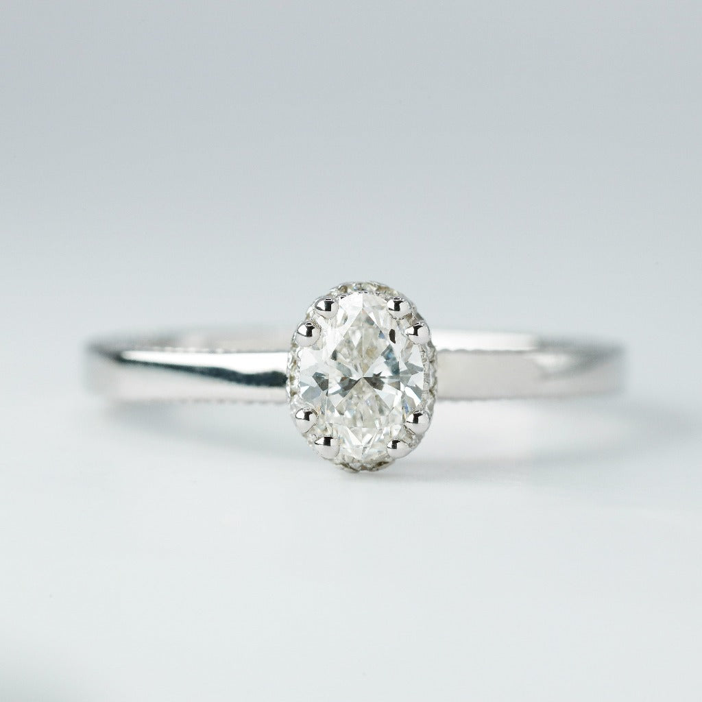 .50ct- center, oval cut .005ct- 23pcs, round cut