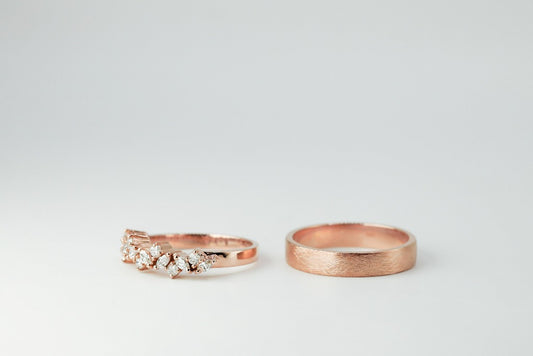 Groom: Plain band, glossy finish Bride: .04ct - 8pcs, marquise cut, genuine diamond .03ct - 7pcs, round cut