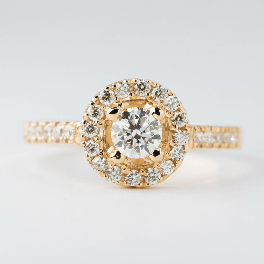 Round brilliant cut with 1ct center stone and round cut with .01ct in elegant halo setting. The stone in the photo is swiss stone by default. You can definitely upgrade your stone into moissanite or genuine diamond with GIA certification. Grams Approx: 3.5