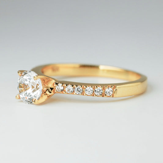 Round brilliant cut with 1ct center stone and .01ct sides stones in timeless pave setting. The stone in the photo is swiss stone by default. You can definitely upgrade your stone into moissanite or genuine diamond with GIA certification. Grams Approx: 3