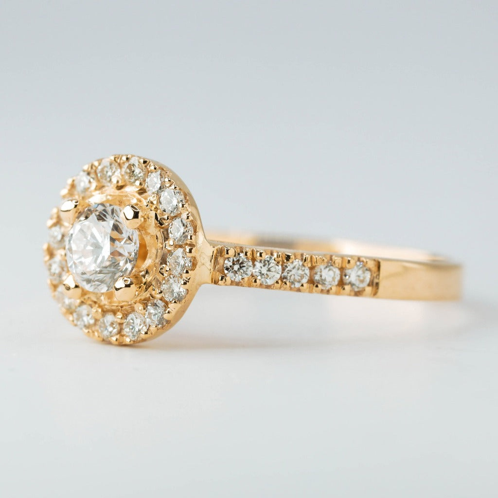 Round brilliant cut with 1ct center stone and round cut with .01ct in elegant halo setting. The stone in the photo is swiss stone by default. You can definitely upgrade your stone into moissanite or genuine diamond with GIA certification. Grams Approx: 3.5