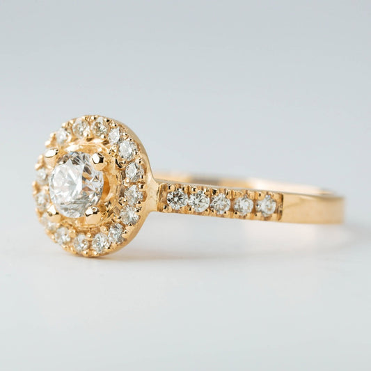 Round brilliant cut with 1ct center stone and round cut with .01ct in elegant halo setting. The stone in the photo is swiss stone by default. You can definitely upgrade your stone into moissanite or genuine diamond with GIA certification. Grams Approx: 3.5