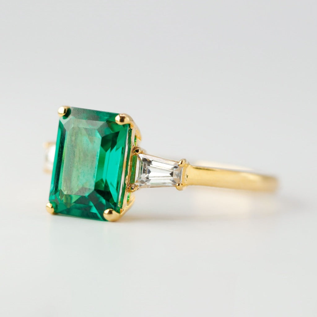 3ct- center, emerald cut, emerald gemstone .25ct – tapered baguette