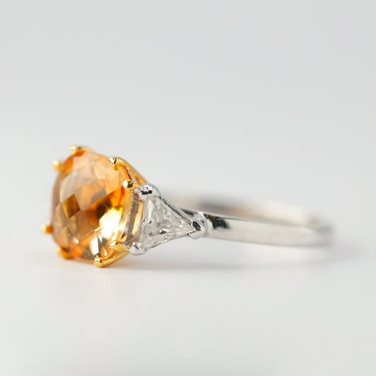 2ct- center, cushion cut, orange topaz gemstone .20ct- 1pc each side (2pcs in total), trilliant cut
