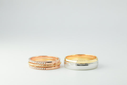 Groom: Plain band Bride: .008ct- 10pcs each sides, genuine diamond Center- milgrain