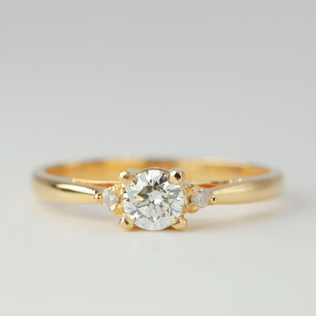 Round brilliant cut with .50ct center stone in classic solitaire setting. The stone in the photo is swiss stone by default. You can definitely upgrade your stone into moissanite or genuine diamond with GIA certification. Grams Approx: 3