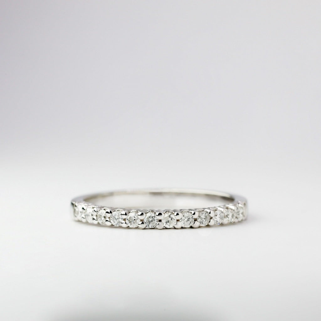 Round brilliant cut with .02ct center stone in eternity setting. The stone in the photo is swiss stone by default. You can definitely upgrade your stone into moissanite or genuine diamond with GIA certification. Grams Approx: 3